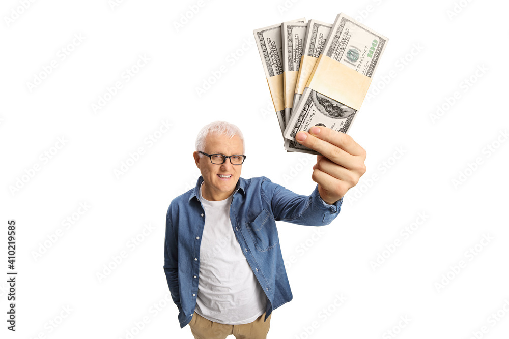 Mature man holding money banknotes in front of camera Mature man holding money banknotes in front of camera