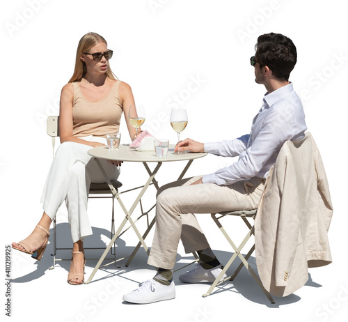 Elegant couple sitting in street café and drinking white wine, isolated on white background