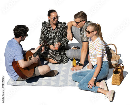 Group of friends having fun at picnic, playing guitar and singing, seen from above and isolated on white background