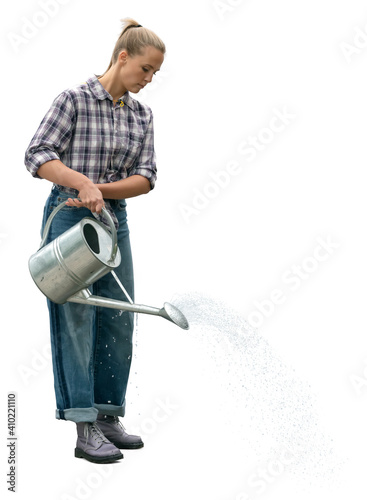 Woman working at the farm watering plants with a watering can, isolated on white background
