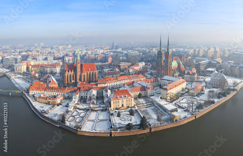 Fototapeta Naklejka Na Ścianę i Meble -  Winter season in Wroclaw, Poland. Panoramic aerial cityscape of Ostrow Tumski (Cathedral Island) on sunny and frosty day