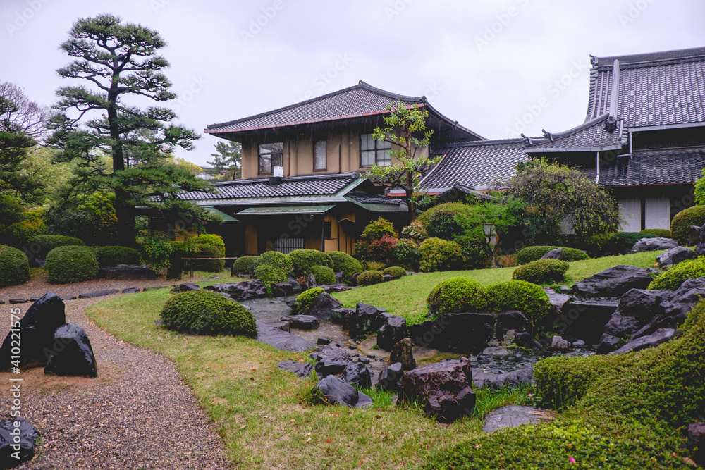 Beautiful traditional garden in a rainy day at Shitenno-ji temple, Osaka, Japan