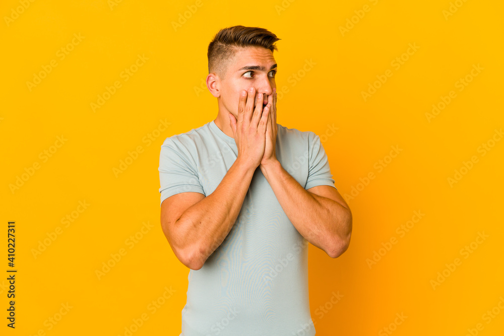 Young handsome caucasian man isolated scared and afraid. Young handsome caucasian man isolated scared and afraid.