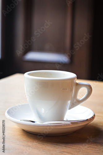 a cup of espresso on a table in a bar, cafe, restaurant