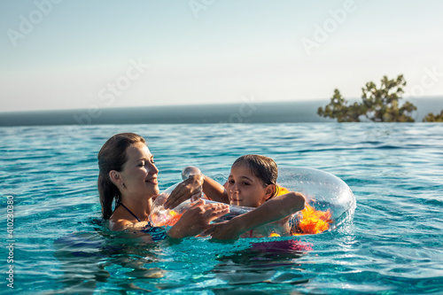 People rest in the hotel swimming pool