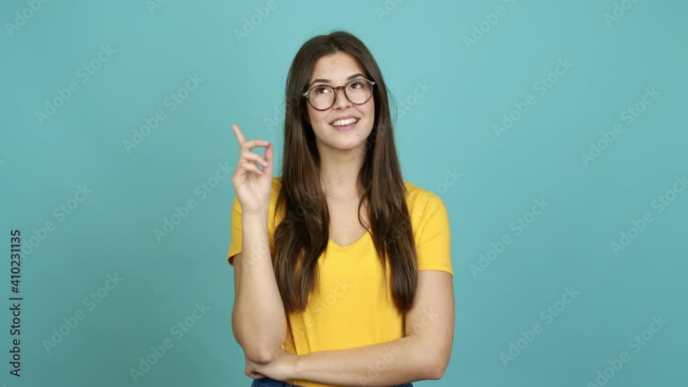 Teenager Brazilian girl with glasses standing and thinking over isolated background Teenager Brazilian girl with glasses standing and thinking over isolated background