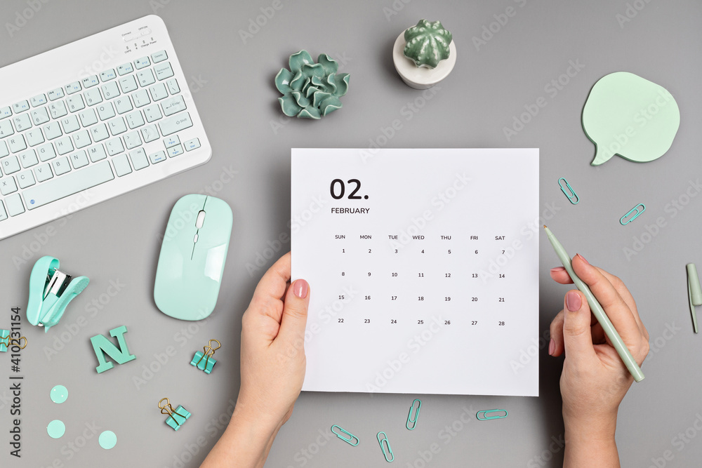 Desktop with calendar for february and office supplies. home office, social  media blog, schedule, planning concept. Flatlay, top view Stock-Foto |  Adobe Stock