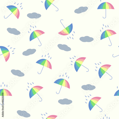 Seamless vector fabric pattern created with umbrellas and clouds