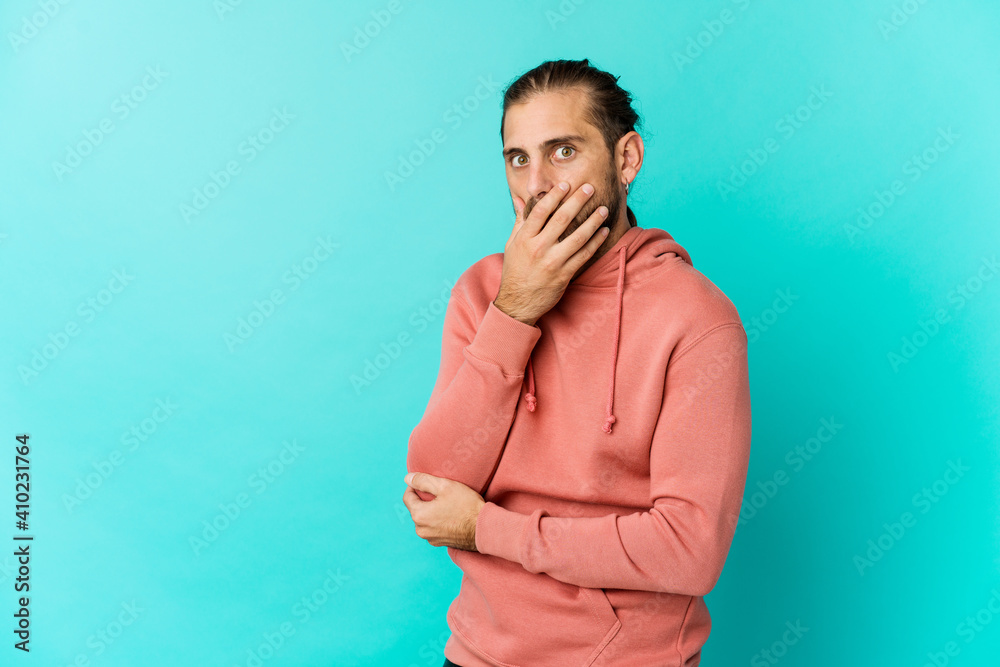 Young man with long hair look scared and afraid. Young man with long hair look scared and afraid.