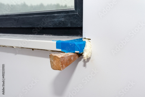 Принти на полотні Newly installed white conglomerate window sill inside the room