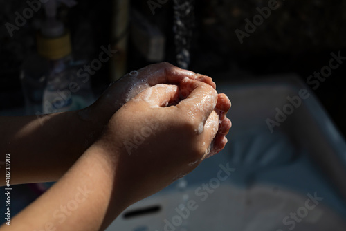 Isolated close-up of person washing hands. Cleaning and body care concept. Hygiene concept hand detail. Corona virus hand hygiene.