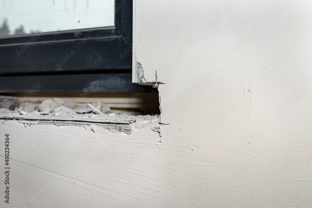Forged place in the wall under the window, prepared for installing a window sill inside the house. Forged place in the wall under the window, prepared for installing a window sill inside the house.