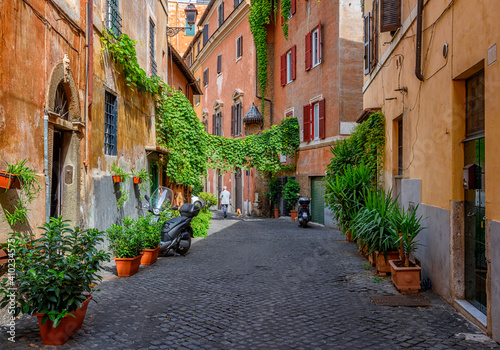 Old street in Trastevere, Rome, Italy. Trastevere is rione of Rome, on west bank of Tiber in Rome. Architecture and landmark of Rome