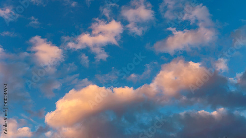 evening blue sky with golden clouds as natural background