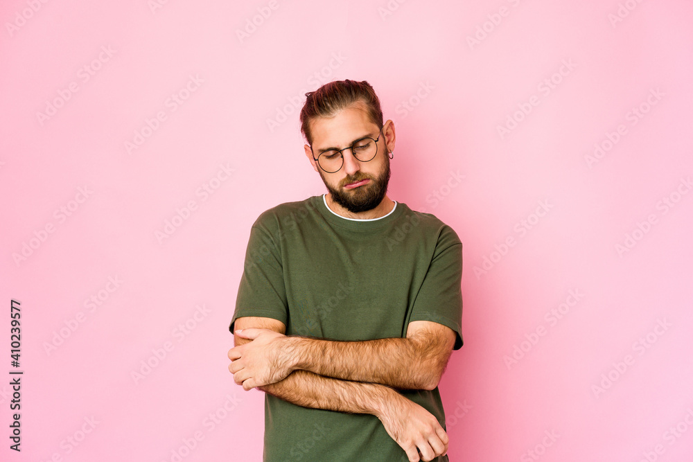 Young man with long hair look tired of a repetitive task. Young man with long hair look tired of a repetitive task.