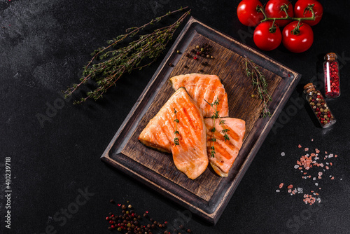 Tasty fresh red fish arctic char baked on a grill