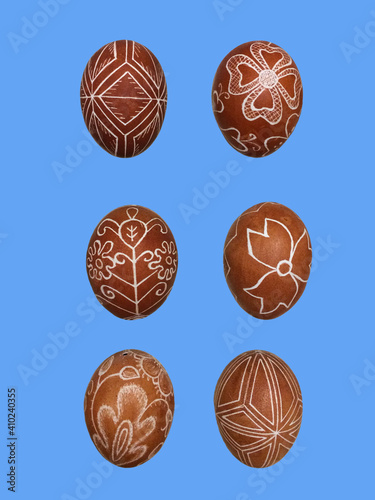 very beautiful painted eggs for the celebration of easter isolated eggs on a blue background