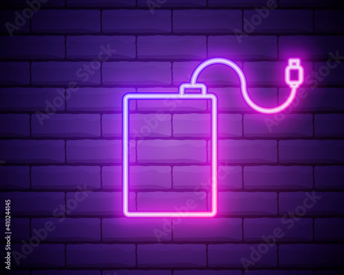 Neon light. HDD icon. Hard disk storage sign. Hard drive memory symbol. Glowing graphic design. Brick wall. Vector photo