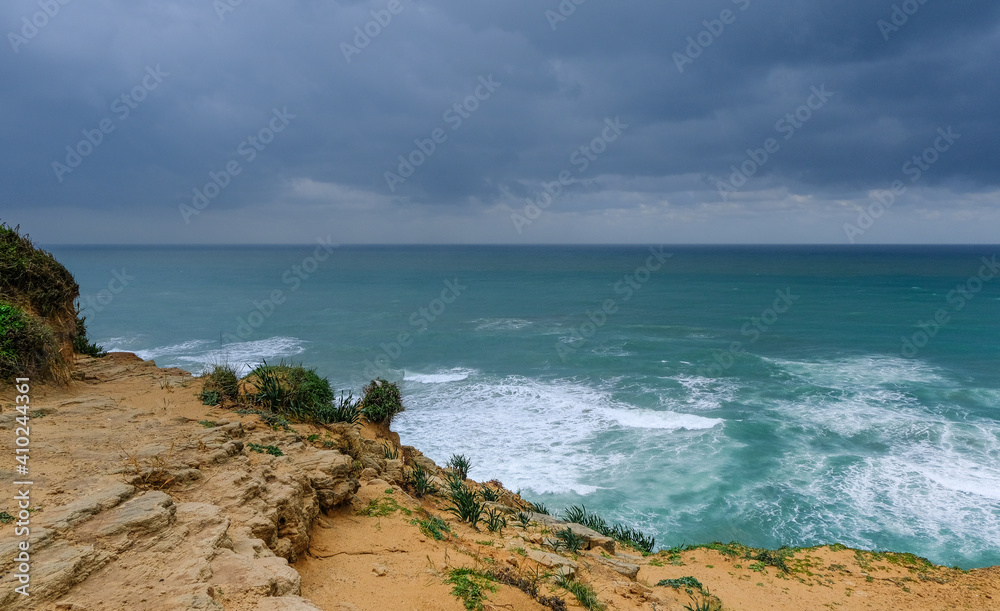 Arsuf cliff, a kurkar sandstone cliff reserve towering high above the Mediterranean sea coastline between Herzliya and Netanya towns, Israel.