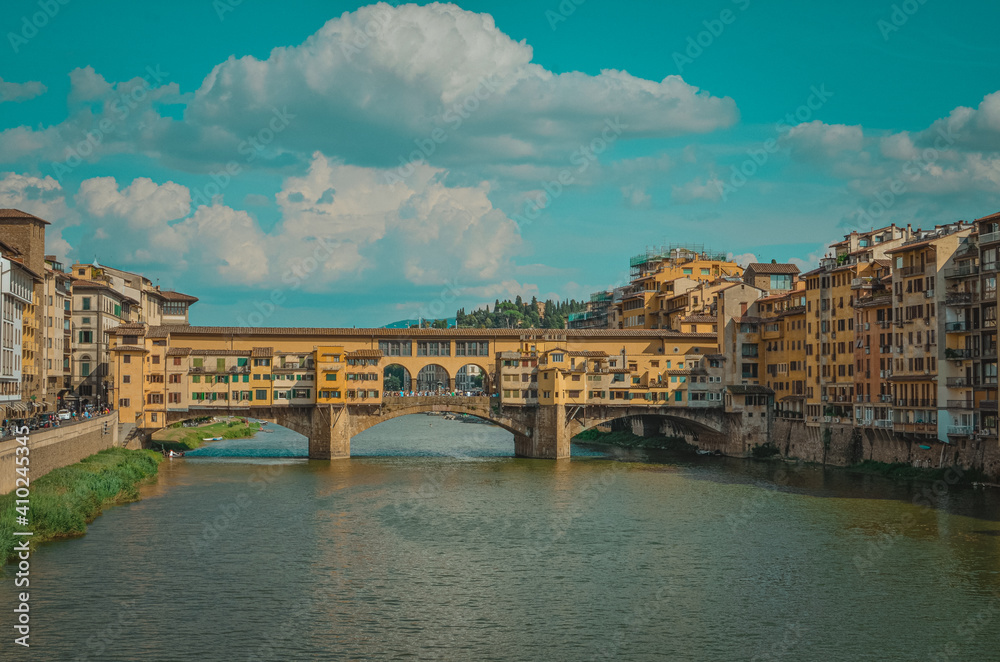 Italy bridge in Tuscan. Blue tones and yellow facade