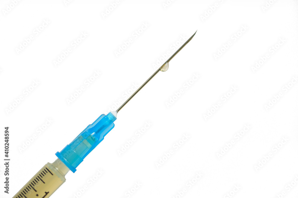 Close up of medicine in a syringe with a needle. Coronavirus vaccination concept. Close up of medicine in a syringe with a needle. Coronavirus vaccination concept.