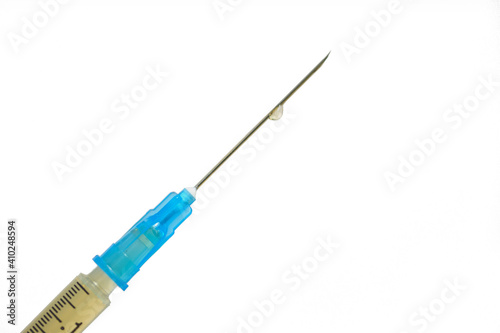 Close up of medicine in a syringe with a needle. Coronavirus vaccination concept.