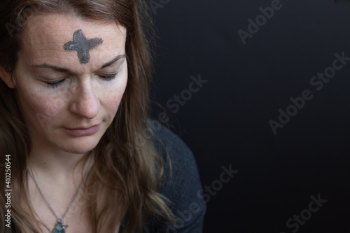 portrait of woman with ash cross on forehead