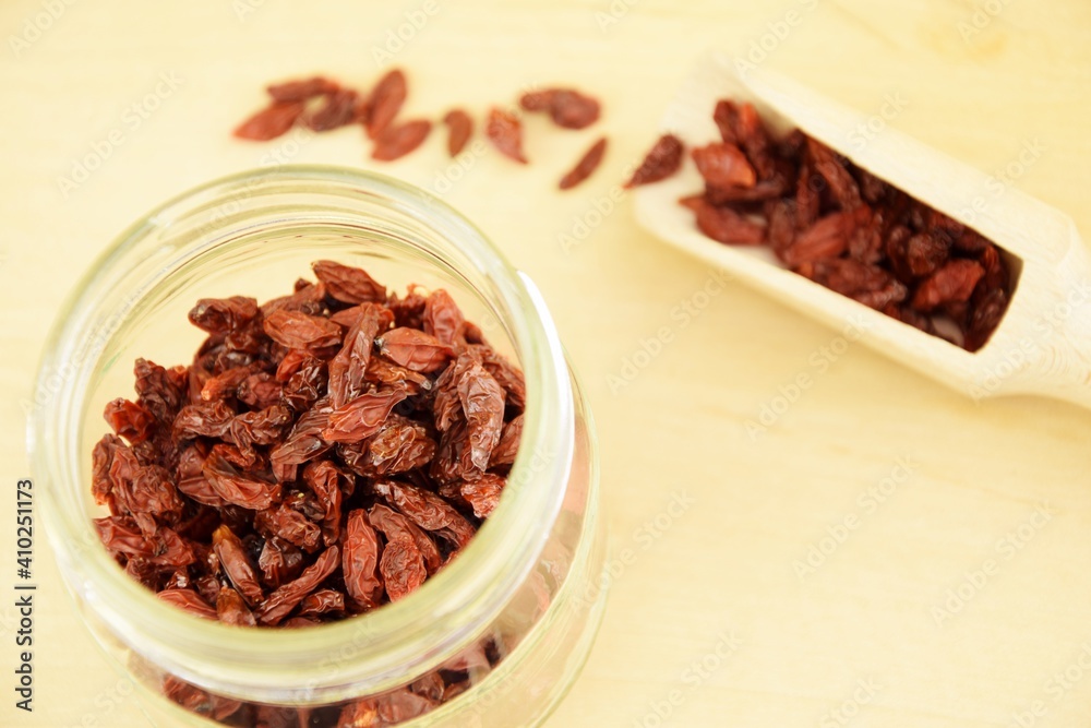 Dried goji berries on jar, wooden background, super food, organic healthy fruits Dried goji berries on jar, wooden background, super food, organic healthy fruits