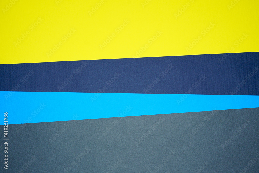 Blue, yellow, gray four tone color paper background with stripes. Abstract background modern hipster futuristic. Texture design Blue, yellow, gray four tone color paper background with stripes. Abstract background modern hipster futuristic. Texture design