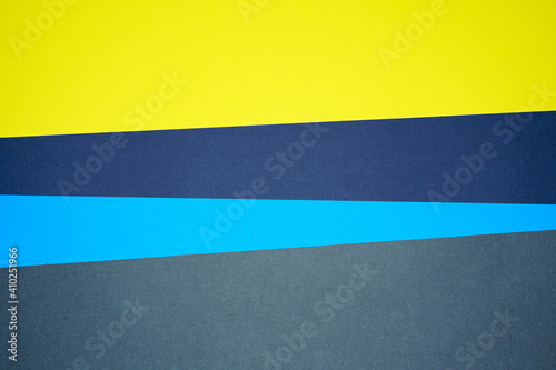 Blue, yellow, gray four tone color paper background with stripes. Abstract background modern hipster futuristic. Texture design