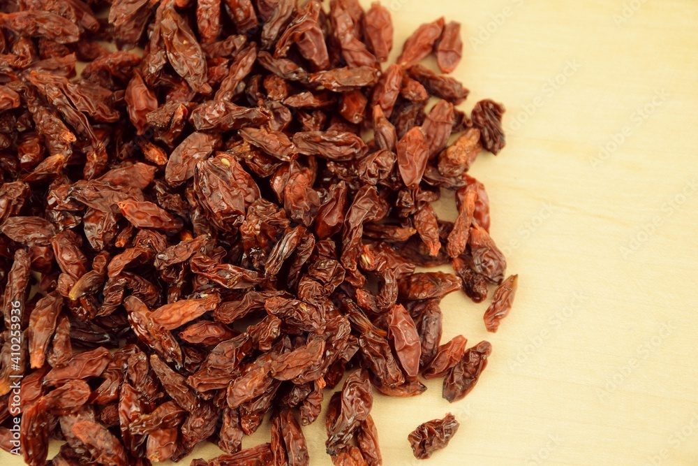 Fototapeta premium Dried goji berries on wooden background, super food, organic