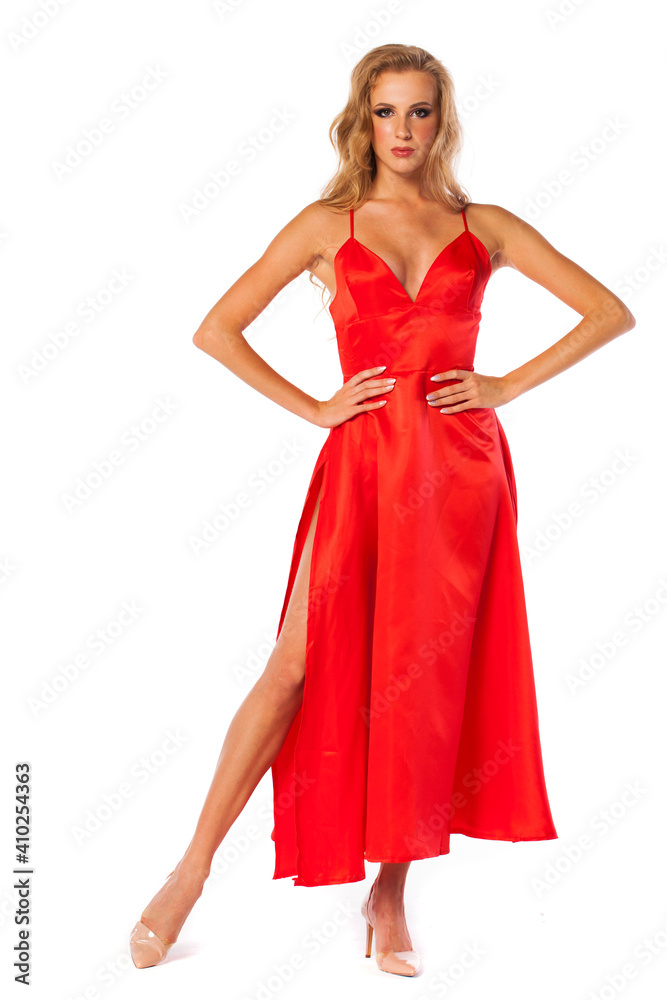 Young beautiful happy blonde woman in red dress