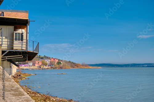 Old town Golyazi, Bursa, Turkey photo after small port and balcony in the town center with the lake of uluabat during sunny day. Bursa. Turkey. 21.01.2021. Colorful buildings and small hill. photo