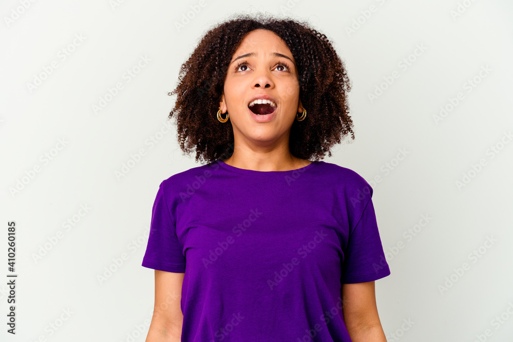 Young african american mixed race woman isolated shouting very angry, rage concept, frustrated. Young african american mixed race woman isolated shouting very angry, rage concept, frustrated.