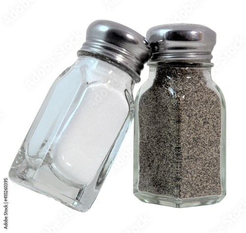 Isolated glass salt and pepper shakers.