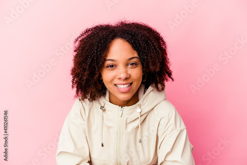 Young african american mixed race woman isolated laughing and having fun.