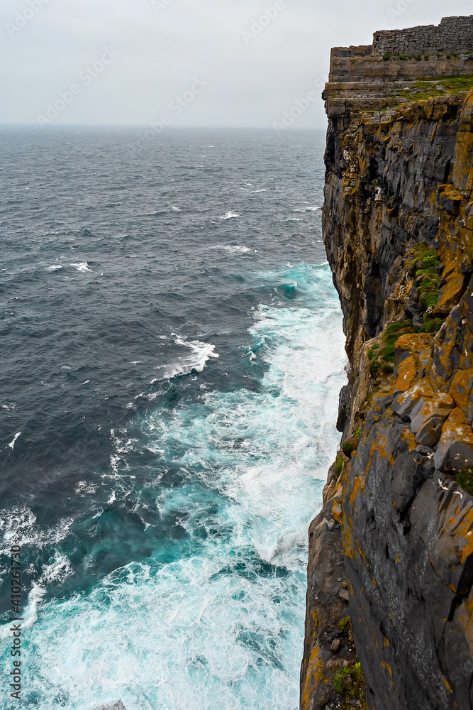 Powerful water of Atlantic ocean at the bottom of a cliff, Aran Islands, Inishmore, county Galway, Ireland.