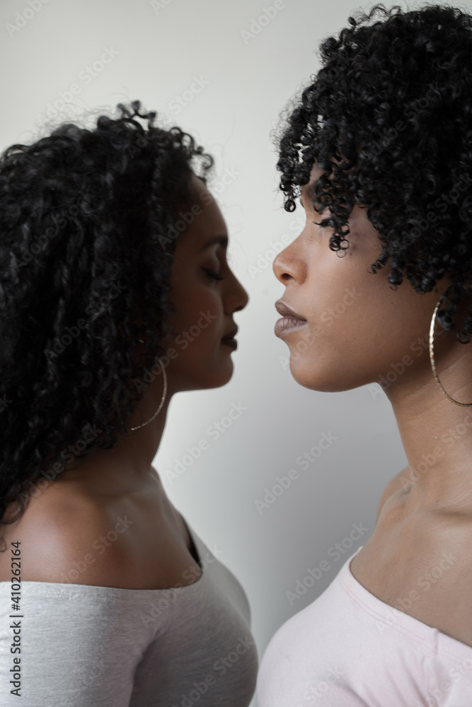 Two beautiful african women opposite each other portrait Two beautiful african women opposite each other portrait