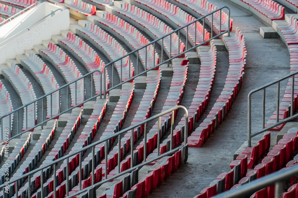 Fototapeta premium Empty football stadium chairs during the pandemic