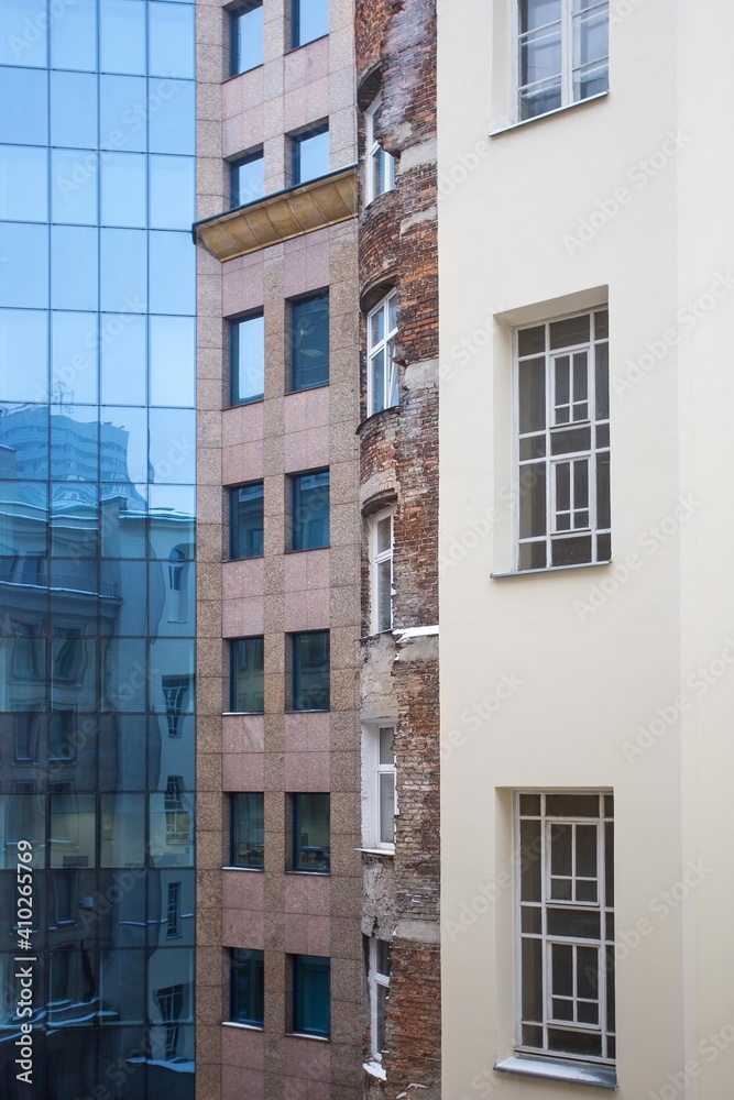 Architecture old and new city collage. Facades of old and new buildings. Blue glass and old red brick in architecture 
