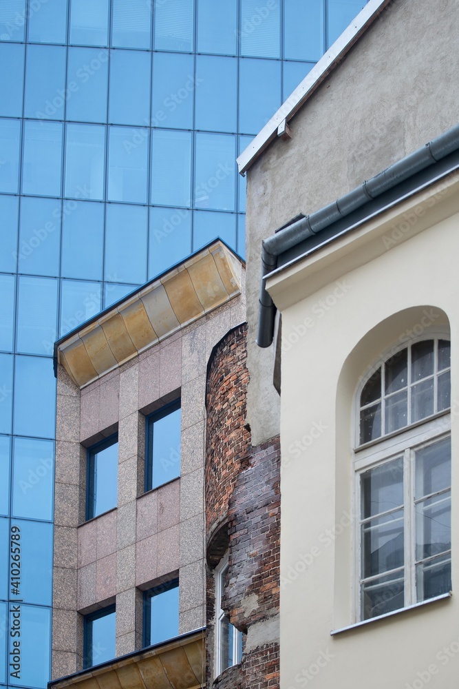 Architecture old and new city collage. Facades of old and new buildings. Blue glass and old red brick in architecture 