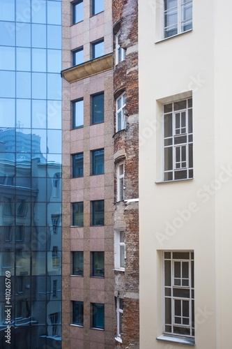 Architecture old and new city collage. Facades of old and new buildings. Blue glass and old red brick in architecture  © Ella