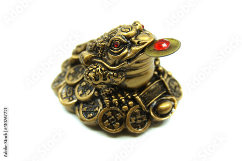 Chinese Feng Shui lucky money frog with coin. Isolated on white background. Closeup