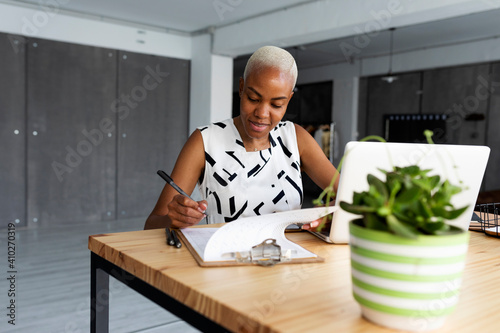 Spain Barcelona, african american woman working at office, mpdern african-american working female alone barcelona casual-office