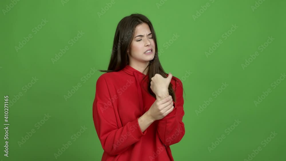 Teenager Brazilian girl with pain in hand over isolated background. Green screen chroma key video Teenager Brazilian girl with pain in hand over isolated background. Green screen chroma key video