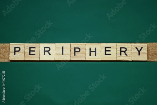 gray word periphery made of wooden square letters on green background