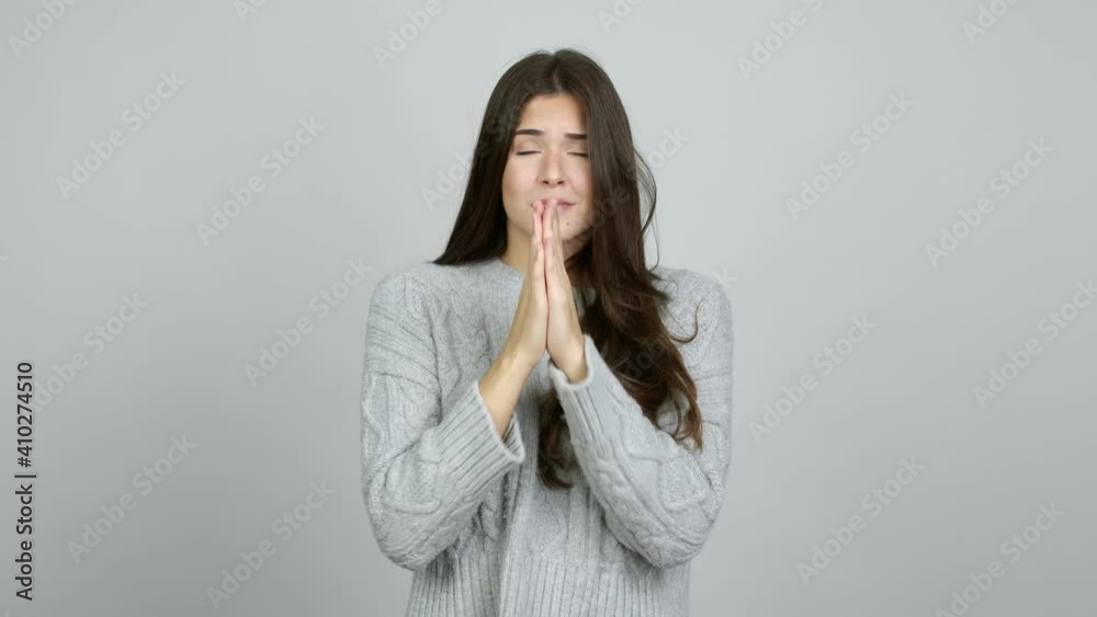 Teenager Brazilian girl pleading over isolated background Teenager Brazilian girl pleading over isolated background