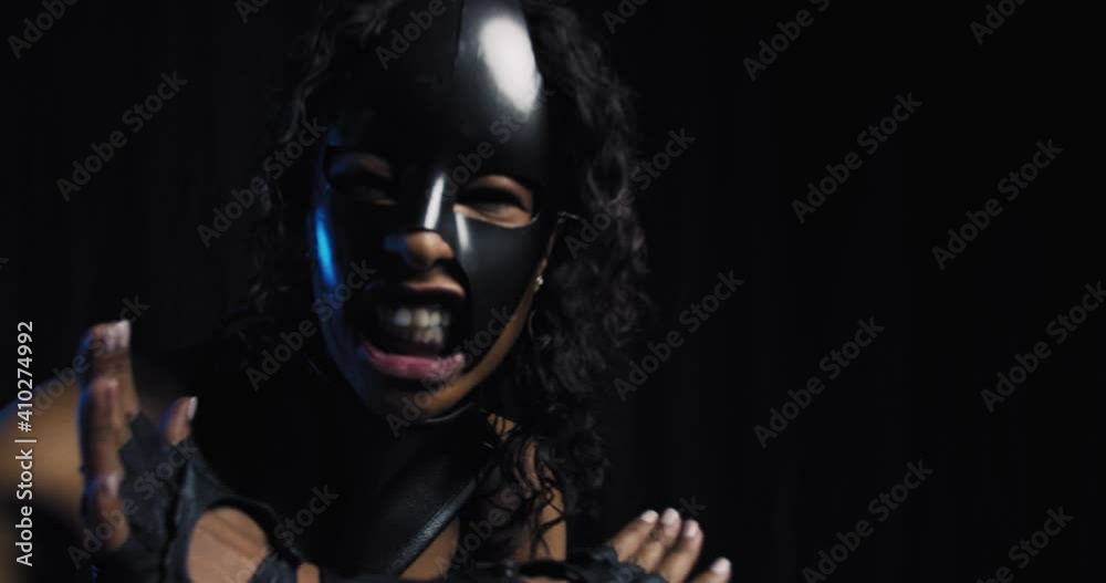 Catwoman wearing the mask and leather outfit is hissing at the camera, 4k Catwoman wearing the mask and leather outfit is hissing at the camera, 4k