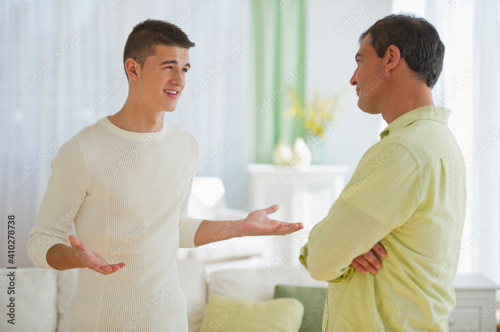 Father and son (16-17) arguing Father and son (16-17) arguing