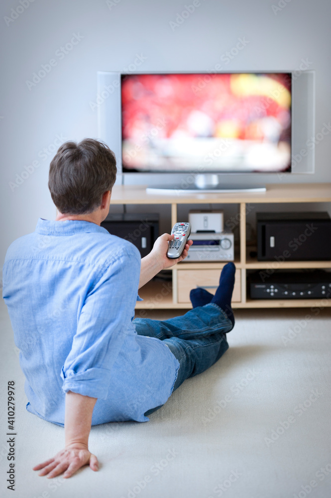 Man watching tv in living room Man watching tv in living room